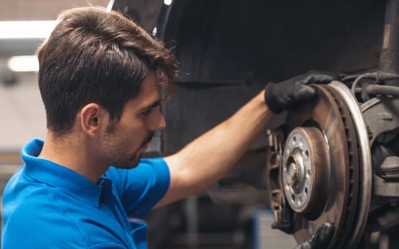 Man changing a car tire